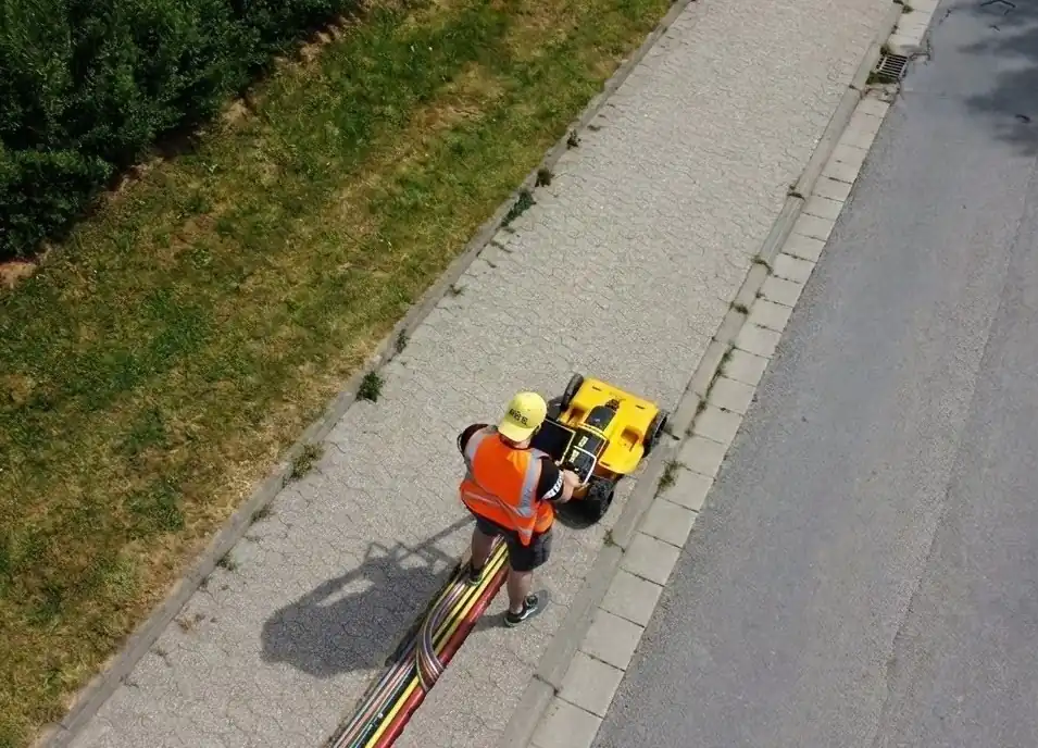 An AI-generated image of a person collecting GPR data on a sidewalk showing underground utilities